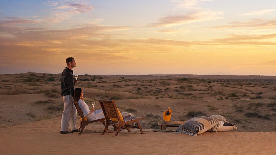 A couple enjoying an evening in the desert