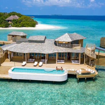 an over water villa with a pool in the Maldives