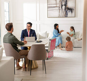 A marhaba representative checking in a family from home