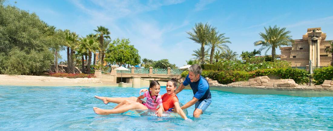 A family having fun at the lazy river at Aquaventure Atlantis