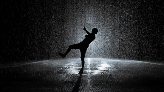 A person dancing at the Rain Room in Sharjah