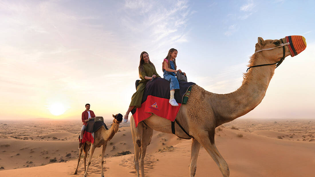 A family on a camel ride in Desert