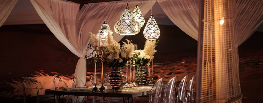 A fancy dinner setup at night in the desert