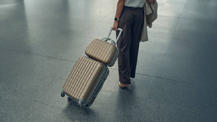 Woman dragging baggage behind her