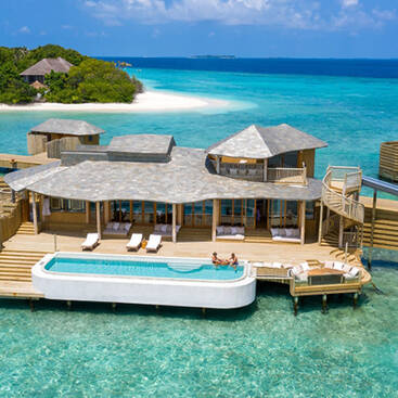 An overwater villa with a pool in the Maldives