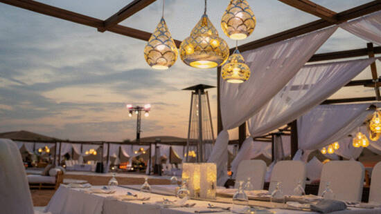 Fancy desert event setup at sunset