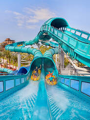 A family enjoying the water slides at Aquaventure