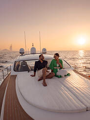 A couple on a yacht at sunset