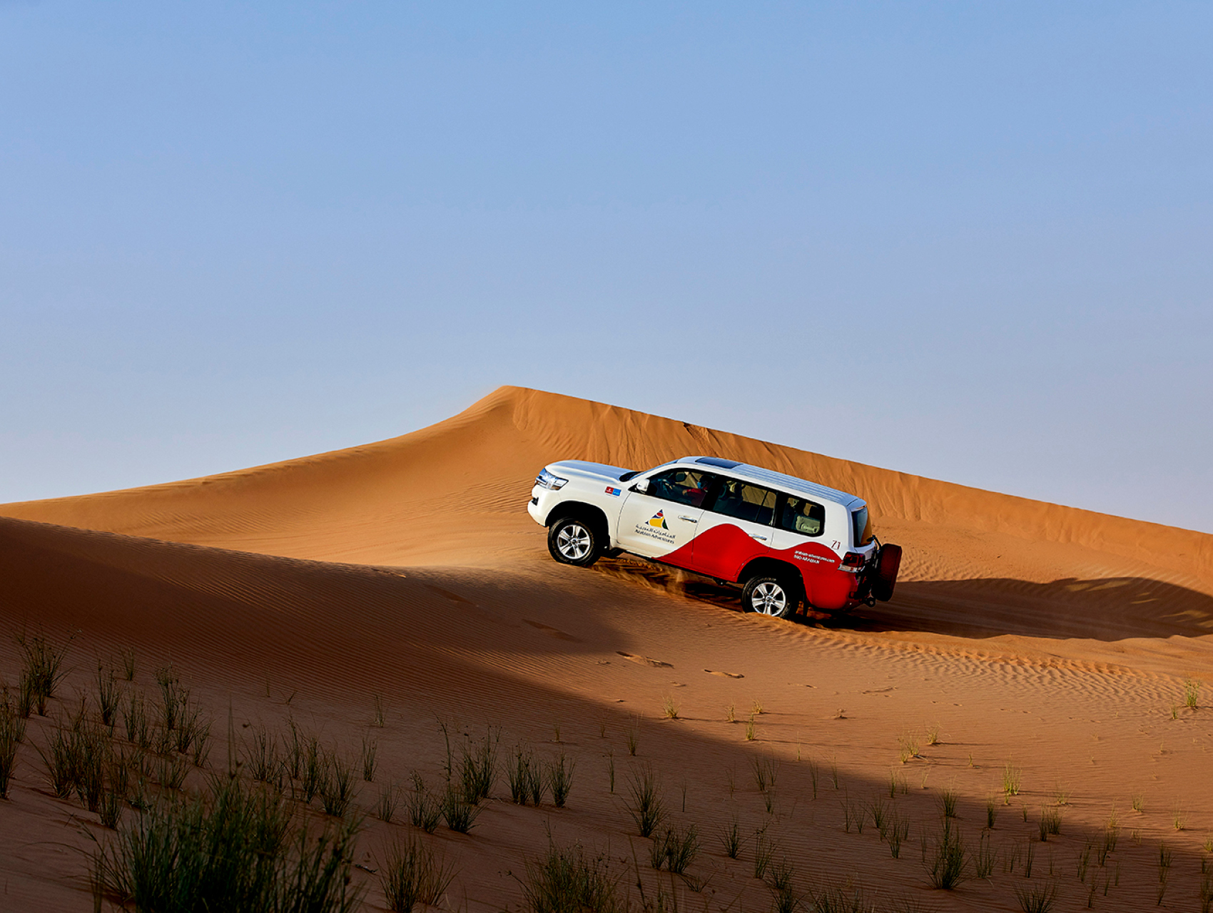 Experience an exciting dune drive in the Dubai desert red dunes 