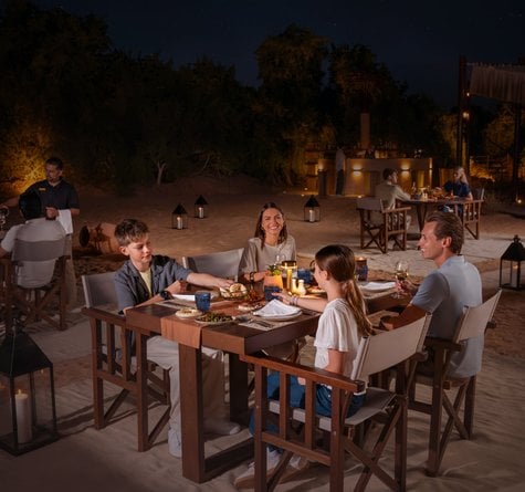 A family having dinner at the Nomad Garden