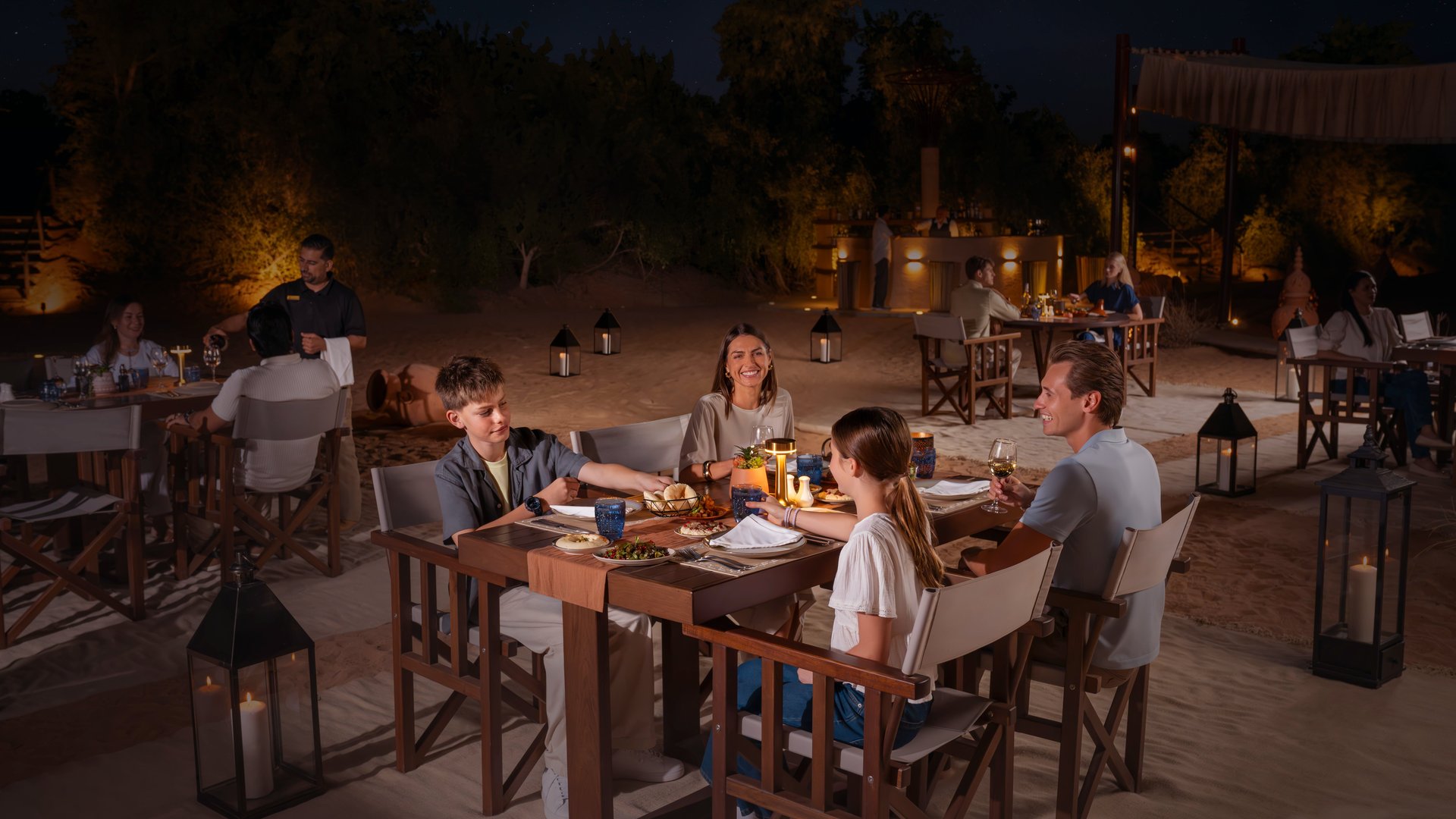 A family having dinner at the Nomad Garden