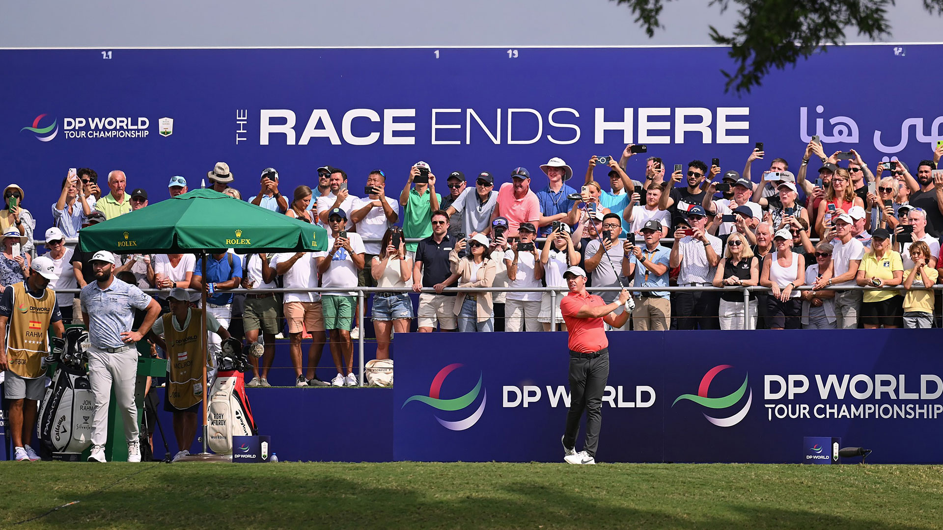 Fans watching the DP World Championship on the golf course on the golf course